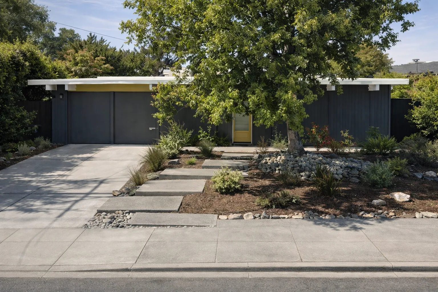 AI-generated illustration of a charcoal-stained Eichler with vertical siding, a yellow front door and a yellow fascia band, behind a mature street tree.